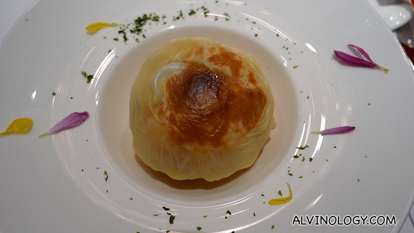 Baked Inaniwa noodles and fresh abalone with cheese served in a mini pumpkin
