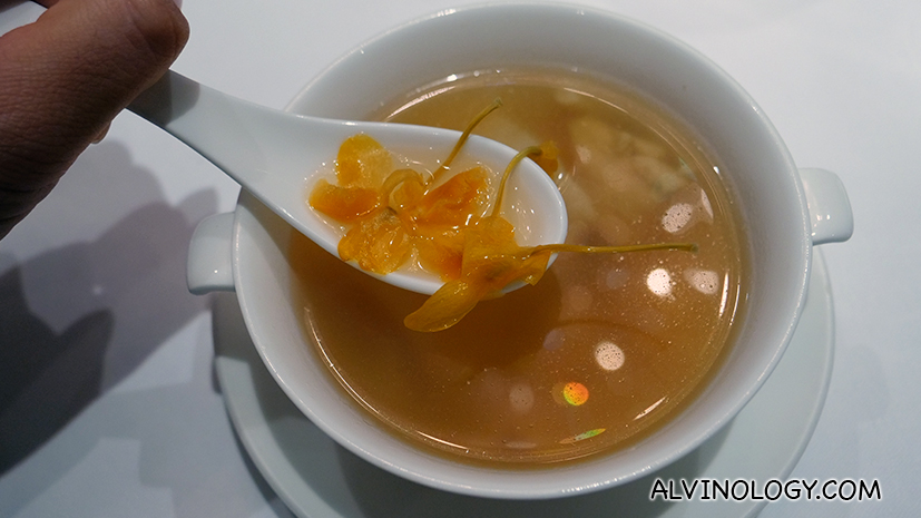 Double-boiled chicken broth with sea conch, fish maw and dendrobium orchid