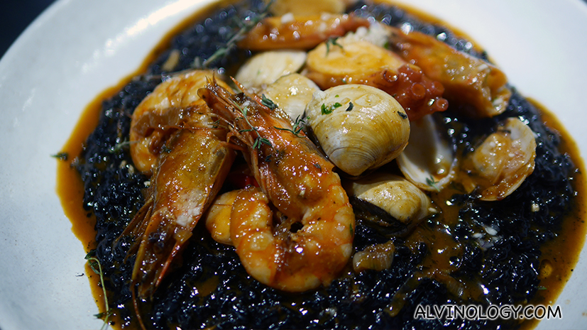 Arroz Negro Wet Paella with Ink, Squids, Clams and Prawns ($52)