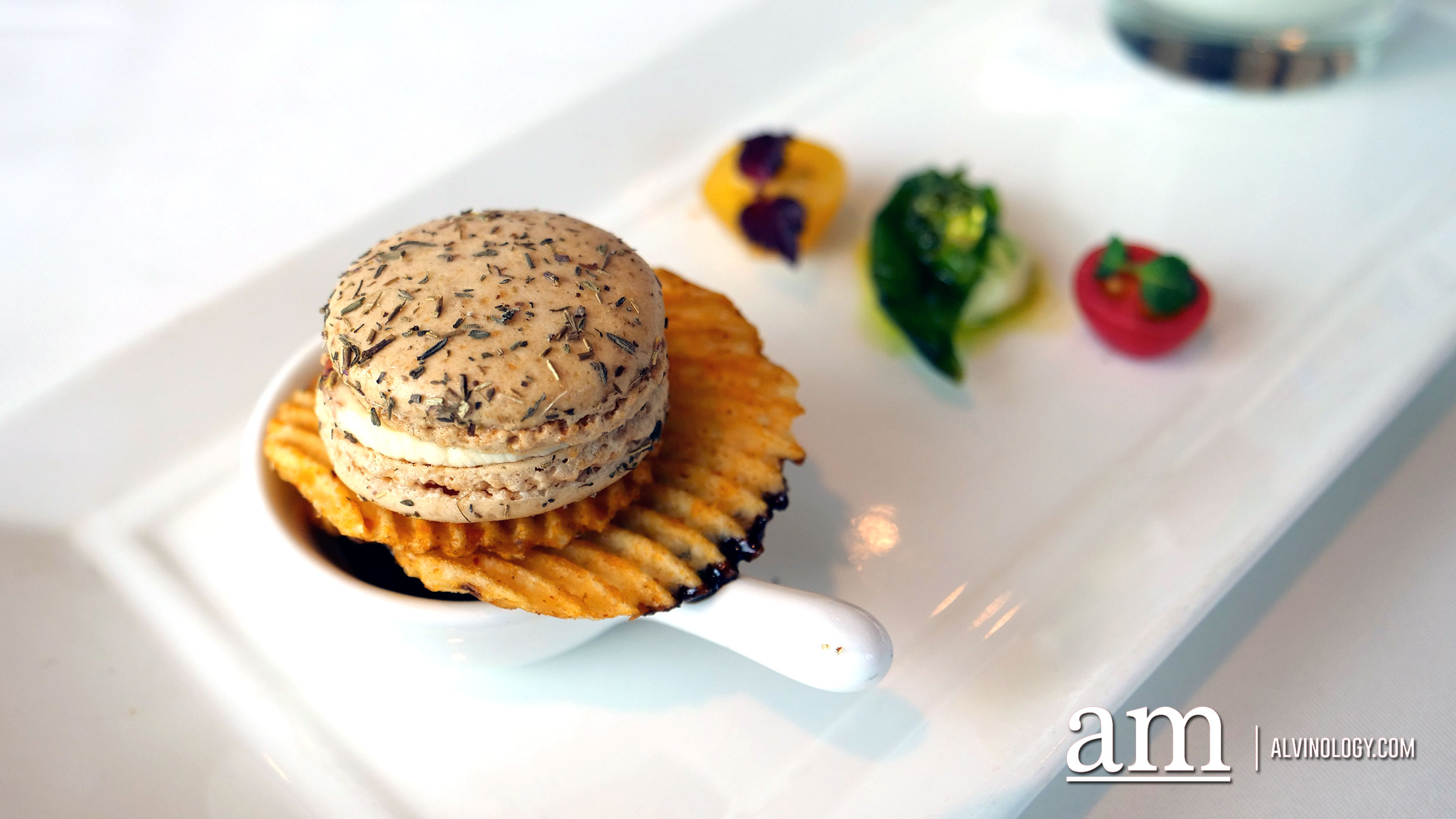 Goat Cheese Macaron infused with Fig and Thyme accompanied with Arbequina Caviar, Cherry Tomato topped with Shiso, Basil Pesto-Mozzarella Balls, Aged Balsamic Reduction and Paprika Chips