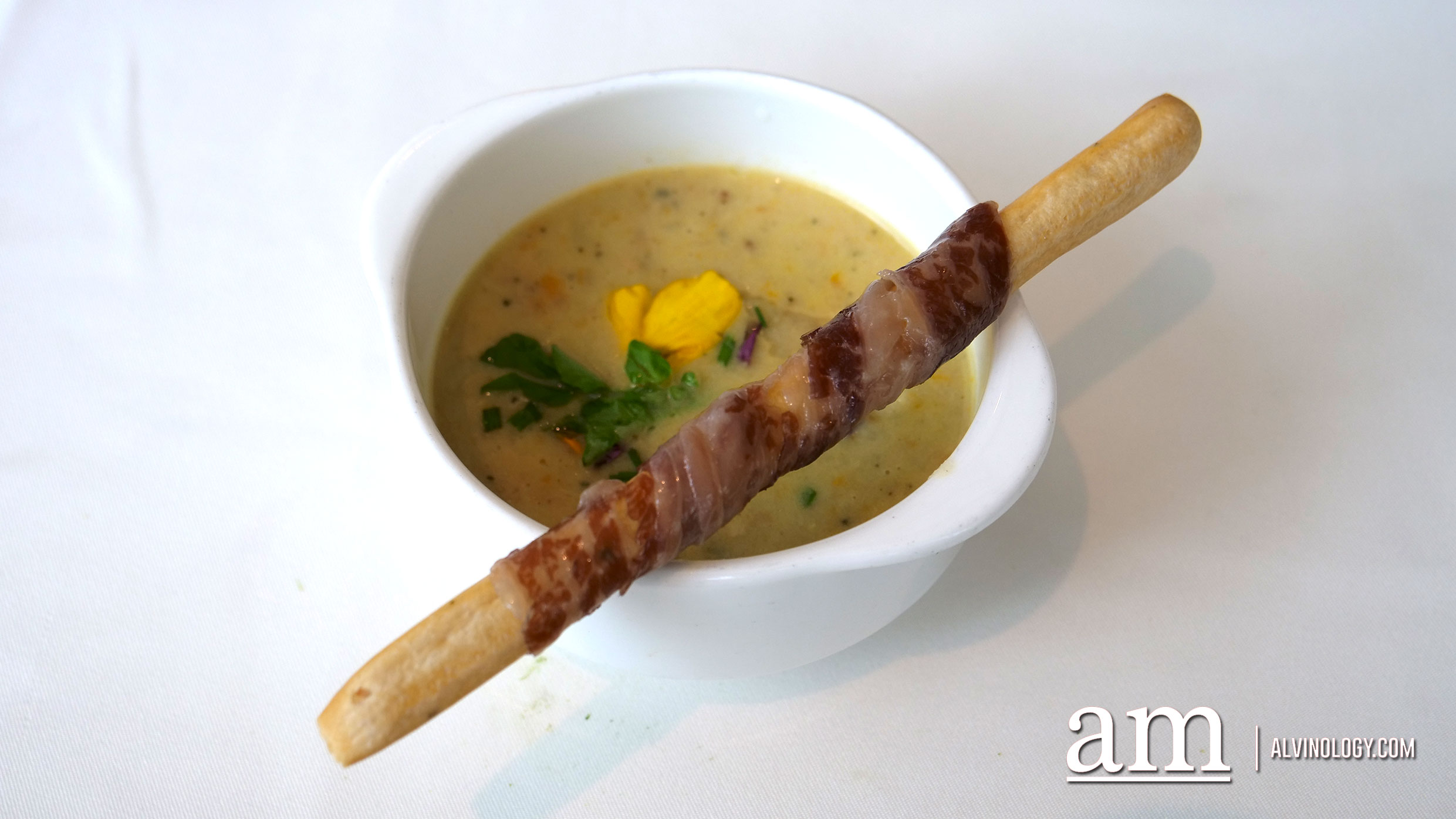 Clam Chowder with Herbed Grissini Wrap with Wagyu Pancia finished with Truffle Oil Drizzle