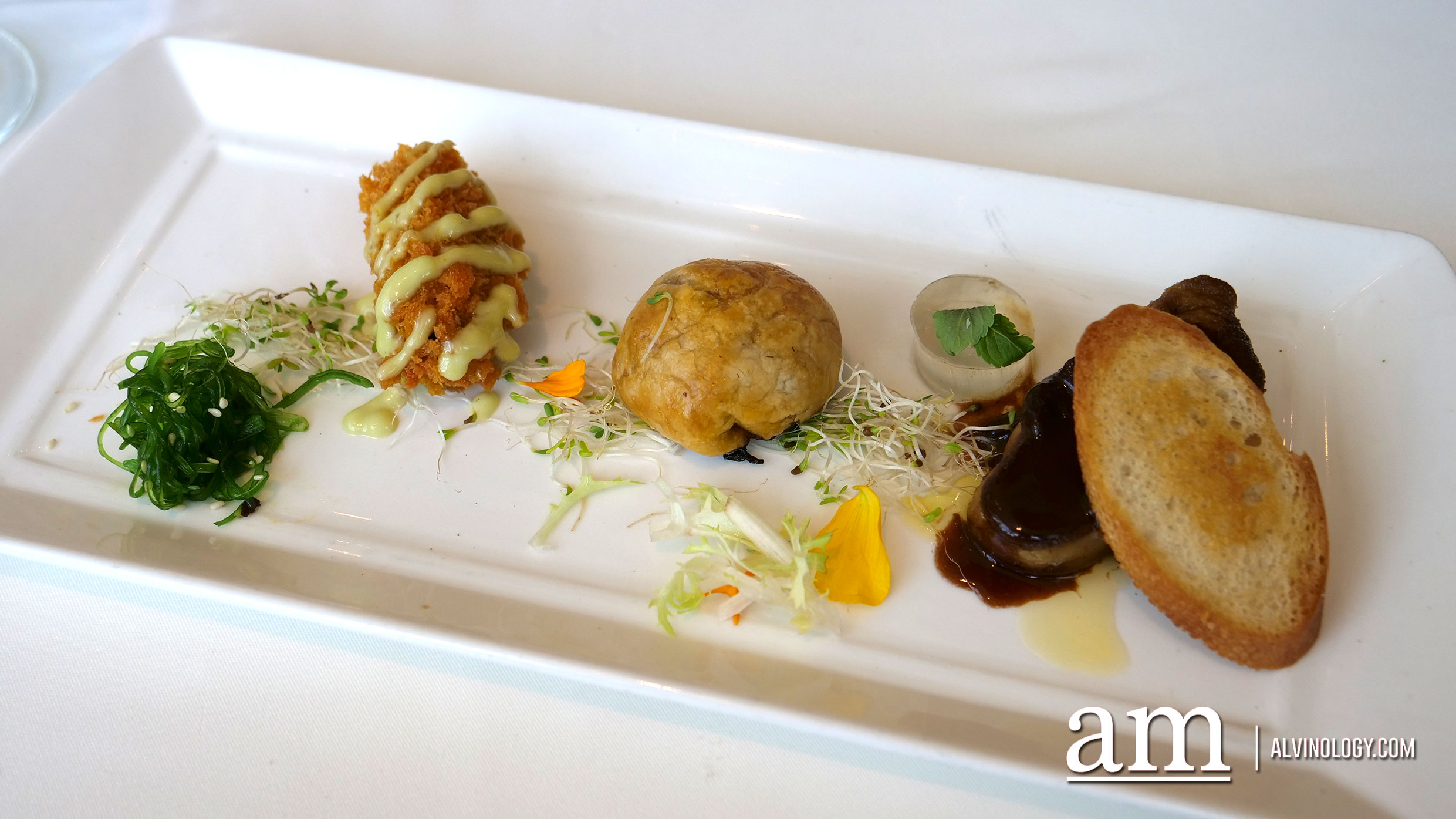 Appetizer trio which comprises of the Crunchy Herb Crumbled Oyster with Wasabi Mayo and Wakami Salad, Over Baked Truffle Wagyu Beef Pithivers and Foie Gras with Thyme Gelee