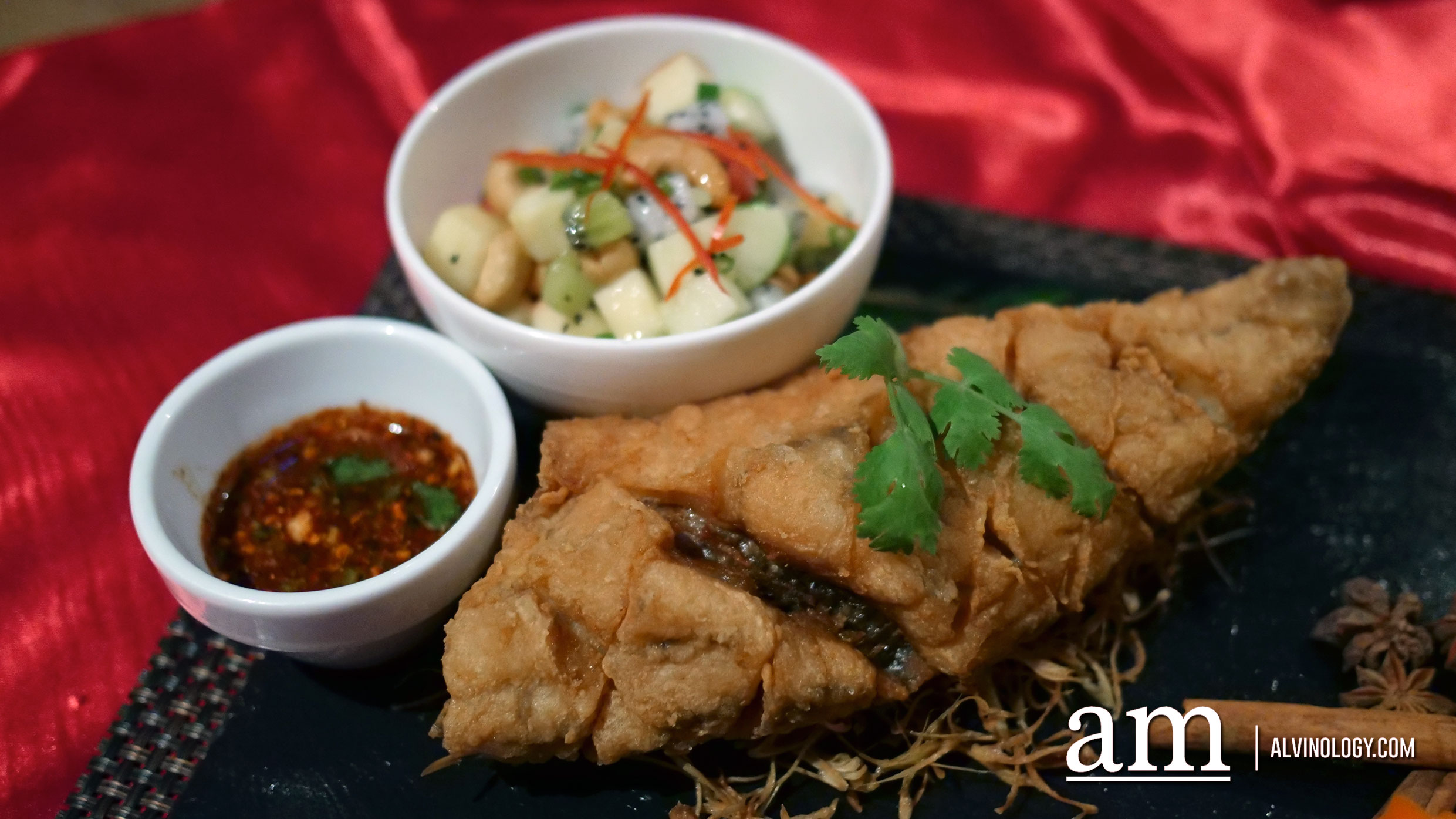 deep-fried sea bass topped with a tasty Thai herbs crust served with betel leaves 