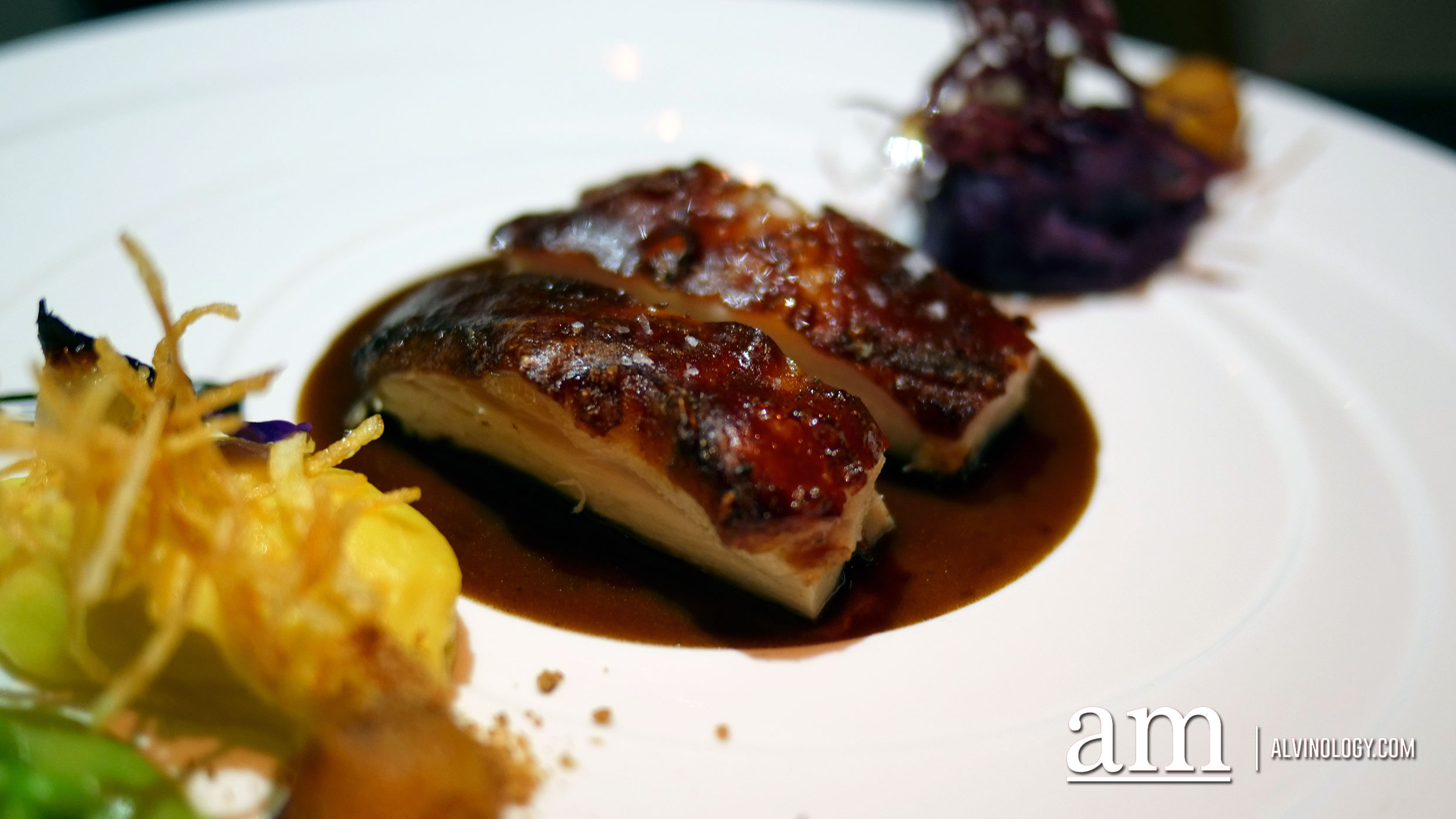 Wood fired roasted suckling pig, saffron and violette potatoes, broad beans and it's own sauce 