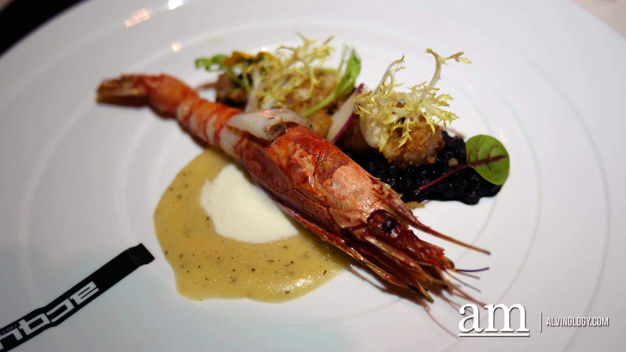 Grilled Sicilian red prawns, baby calamari and Italian lard from Colonnata, yellow polenta with stracchino and black fregola pasta