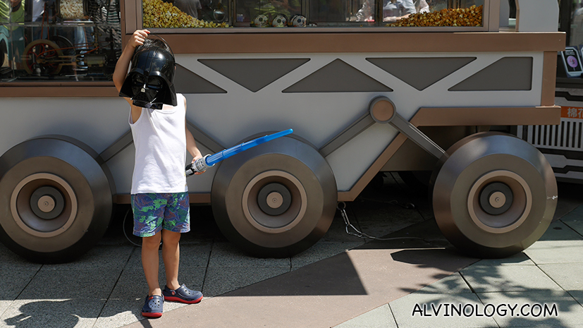 When you buy popcorn at the park, you get to take home this Darth Vader mask shaped container 