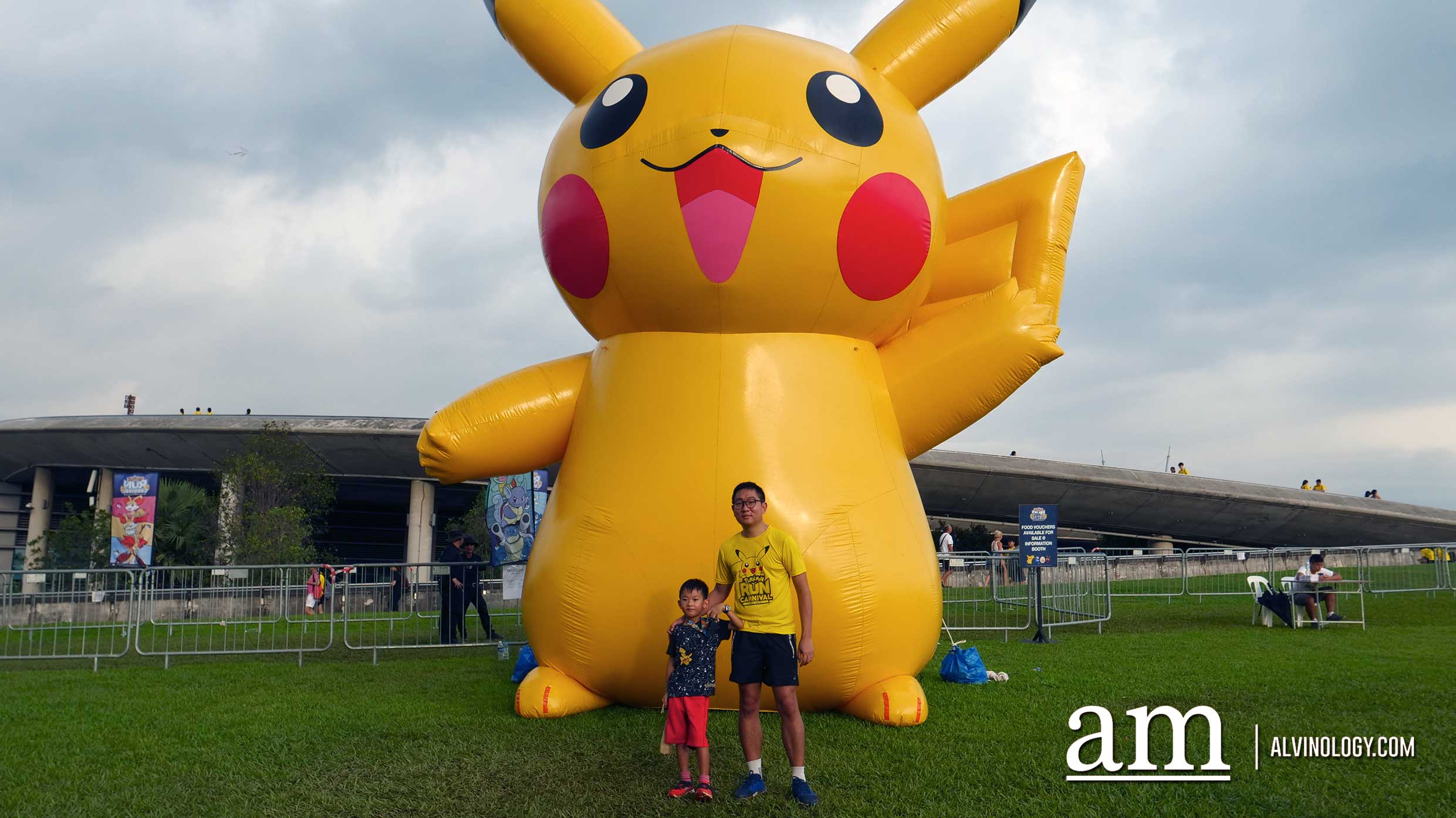 Asher and I posing with a giant Pikachu 