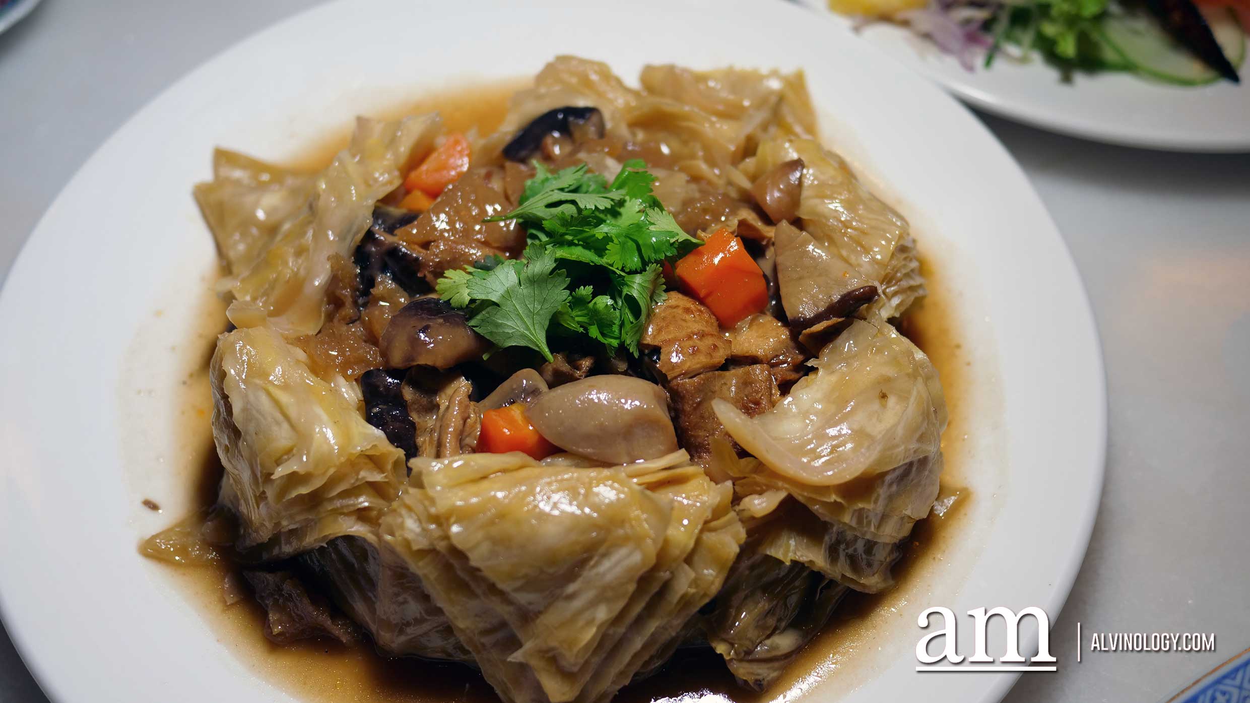 How about a Peranakan-style Lunar New Year reunion dinner this year? Available at INDOCAFE - the white house Nonya steamed cabbage with mixed mushroom and pork skin