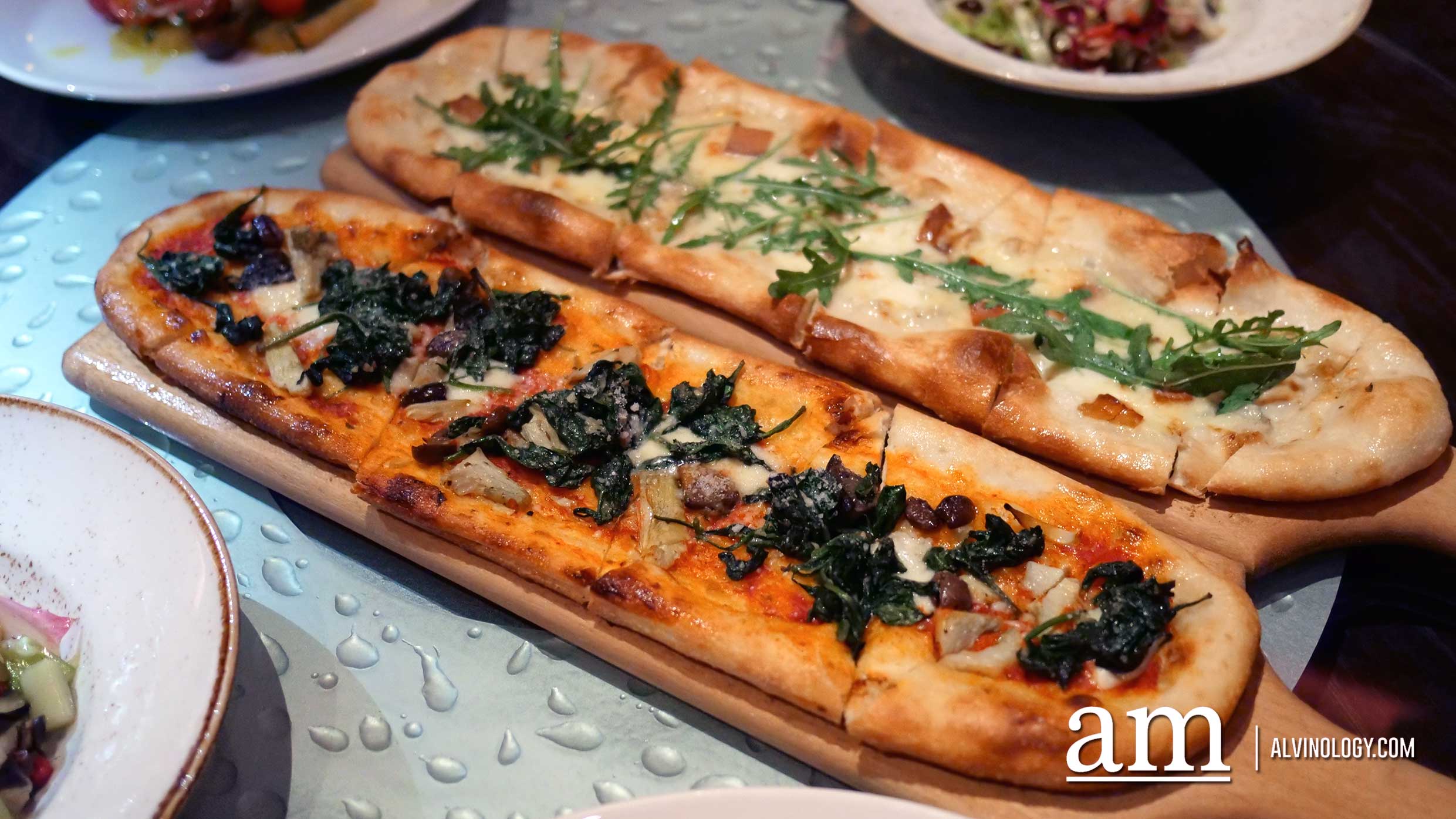 Left: Spinach and Artichoke Pizza; Right: Quattro Formaggi Pizza