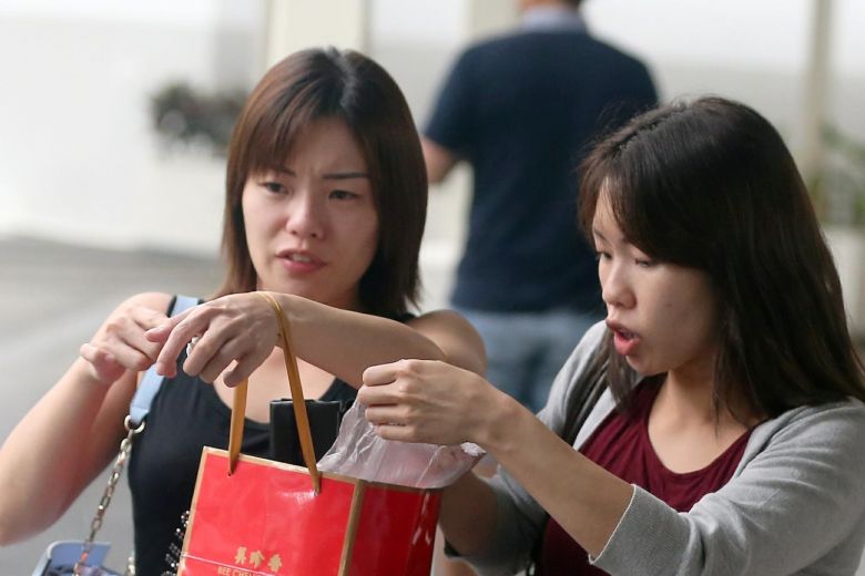 Tiffany (left) and Tiziana Kang, 30. (Image credit: Wong Kwai Chow via straitstimes.com)