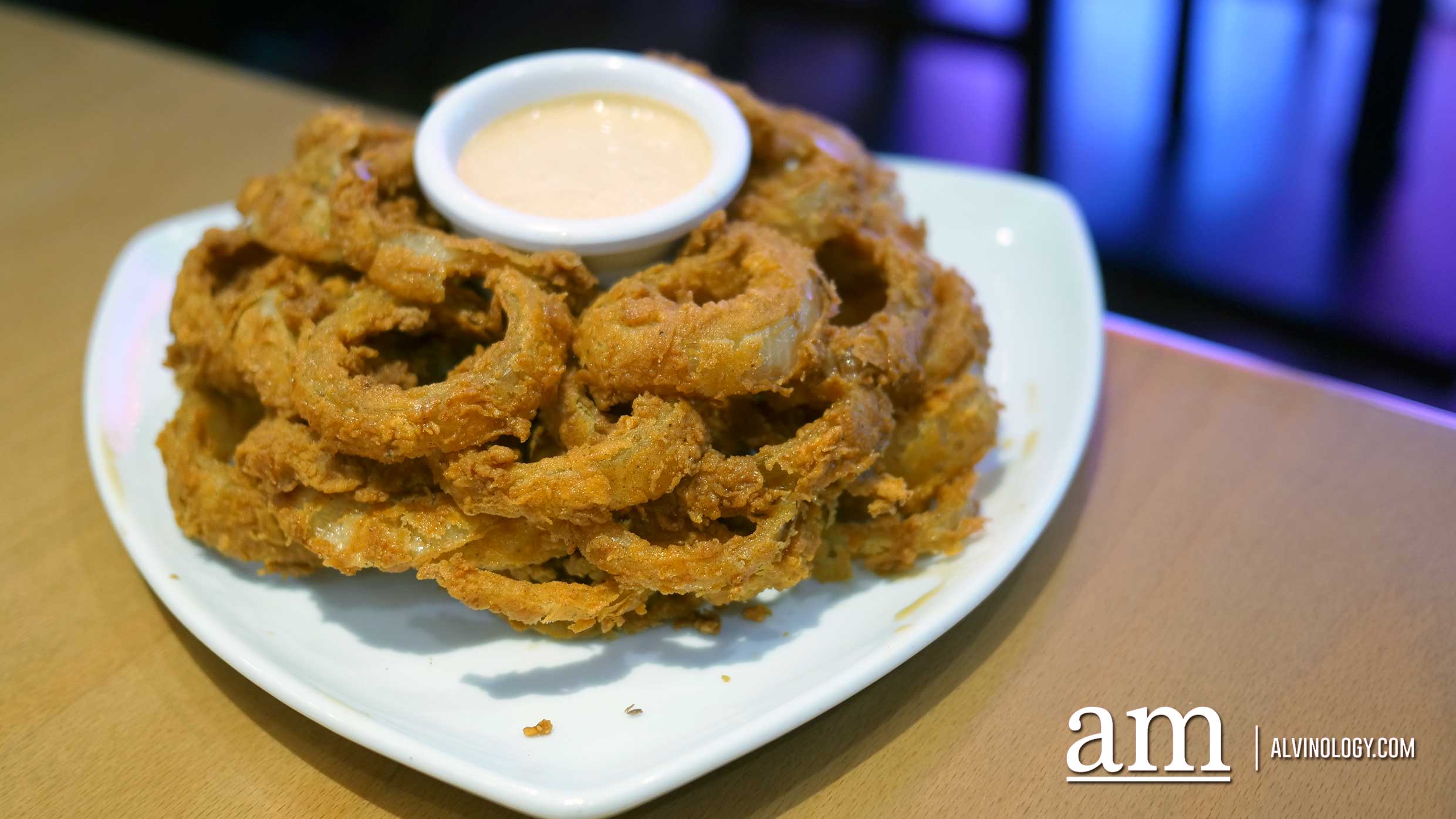 Typhoon Bloom (S$15.90) - Hand-cut, fresh onion strings dusted with Outback’s own secret seasonings, stacked high and cooked until golden. Served with our spicy signature bloom sauce. - 