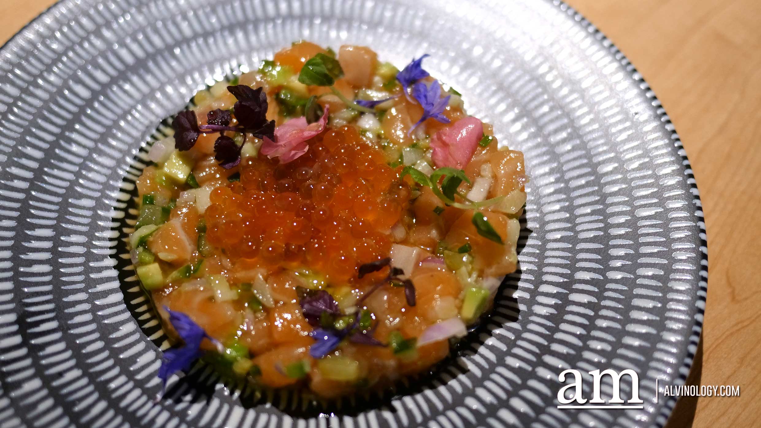 Salmon Tartare ($9) - avocado, shallots, jalepeno, cucumber, pickled ginger, honey, edible flowers