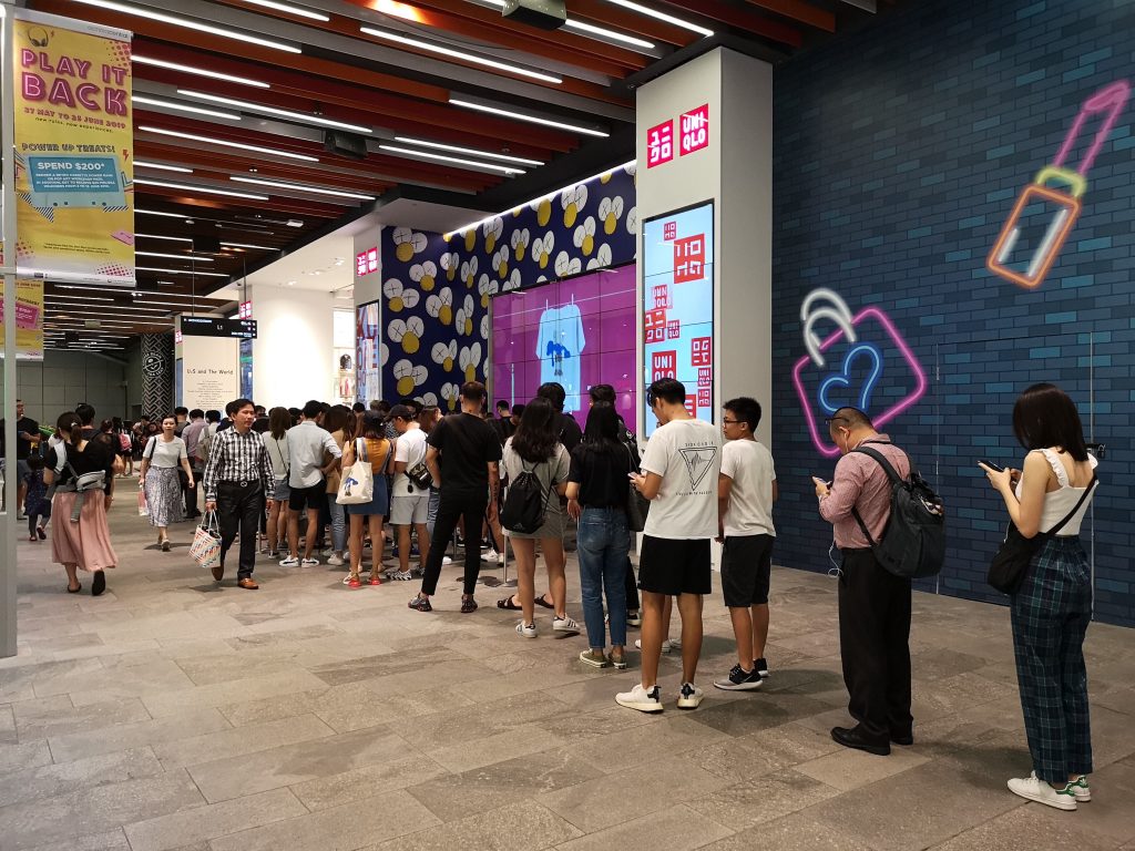 Singaporean shoppers irate over "horrible" Uniqlo x KAWS launch More than 100 people were seen joining the queue to enter the UT gallery at Uniqlo's flagship store in Orchard Central.