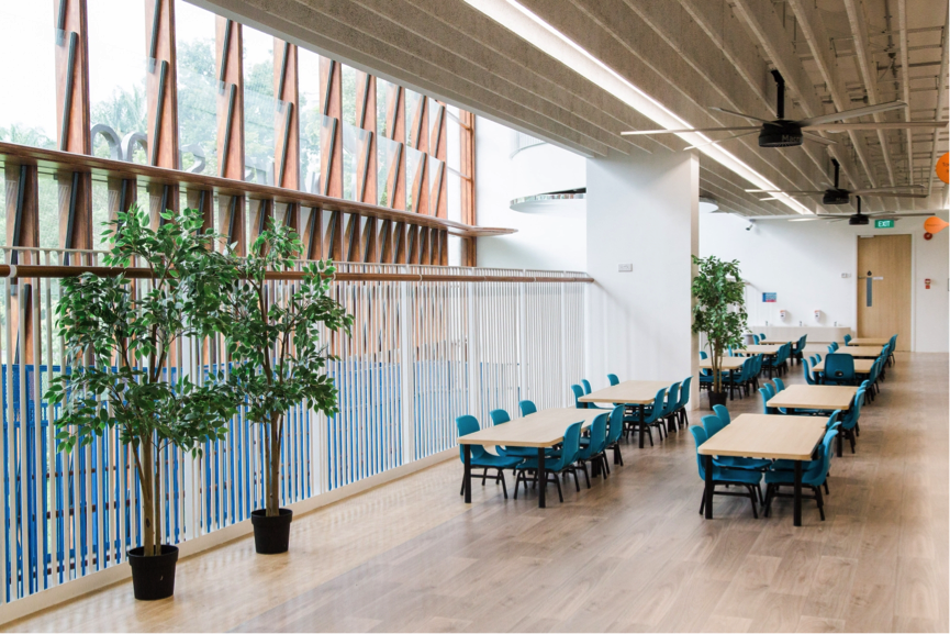A separate dining area where multi-age integration occurs. With the large glass panel windows, children can observe and connect with what is happening outside the centre, creating social interaction opportunities between the children where they can chat about the weather and happenings in the park.