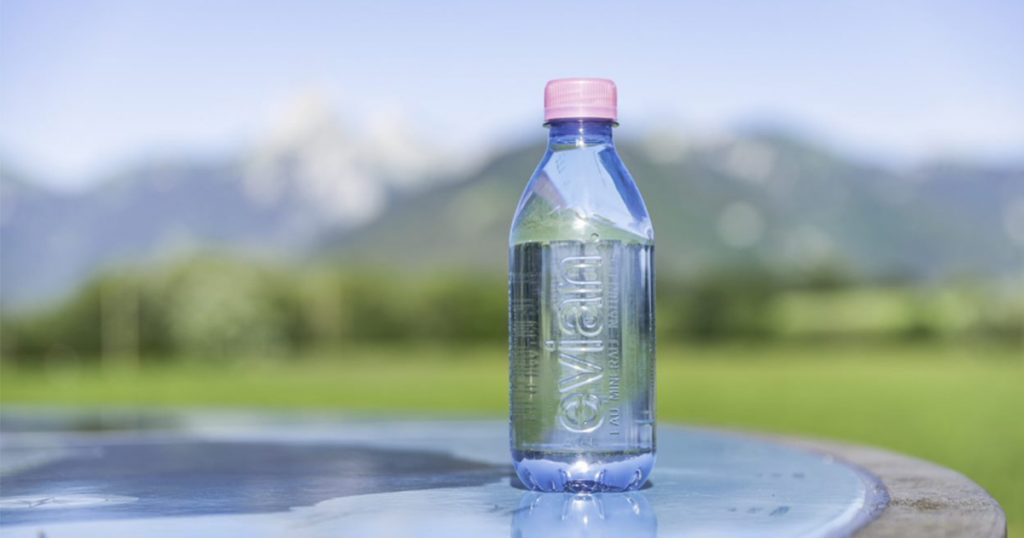 Evian natural mineral water bottles now have a pink bottle cap and 100% recyclable made from 100% recycled plastic - Alvinology