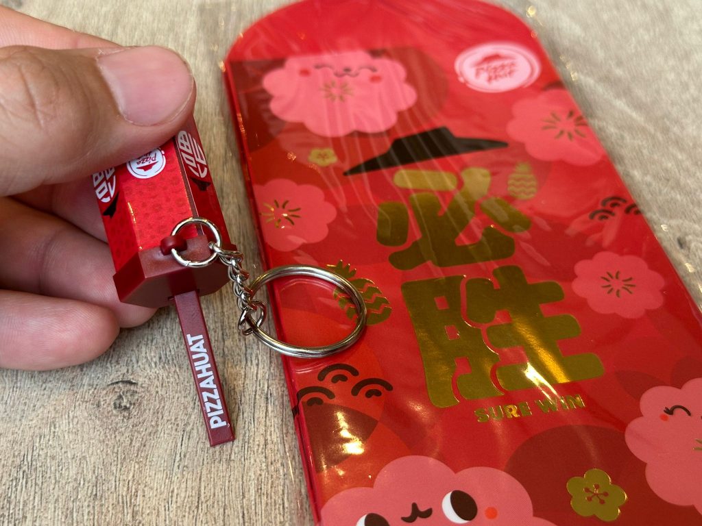 [Promo Alert] Pizza Hut Singapore Launches an Interactive Huat Keychain and Sweet ‘N’ Sour Blossom Pizza for Lunar New Year 2025 - Alvinology