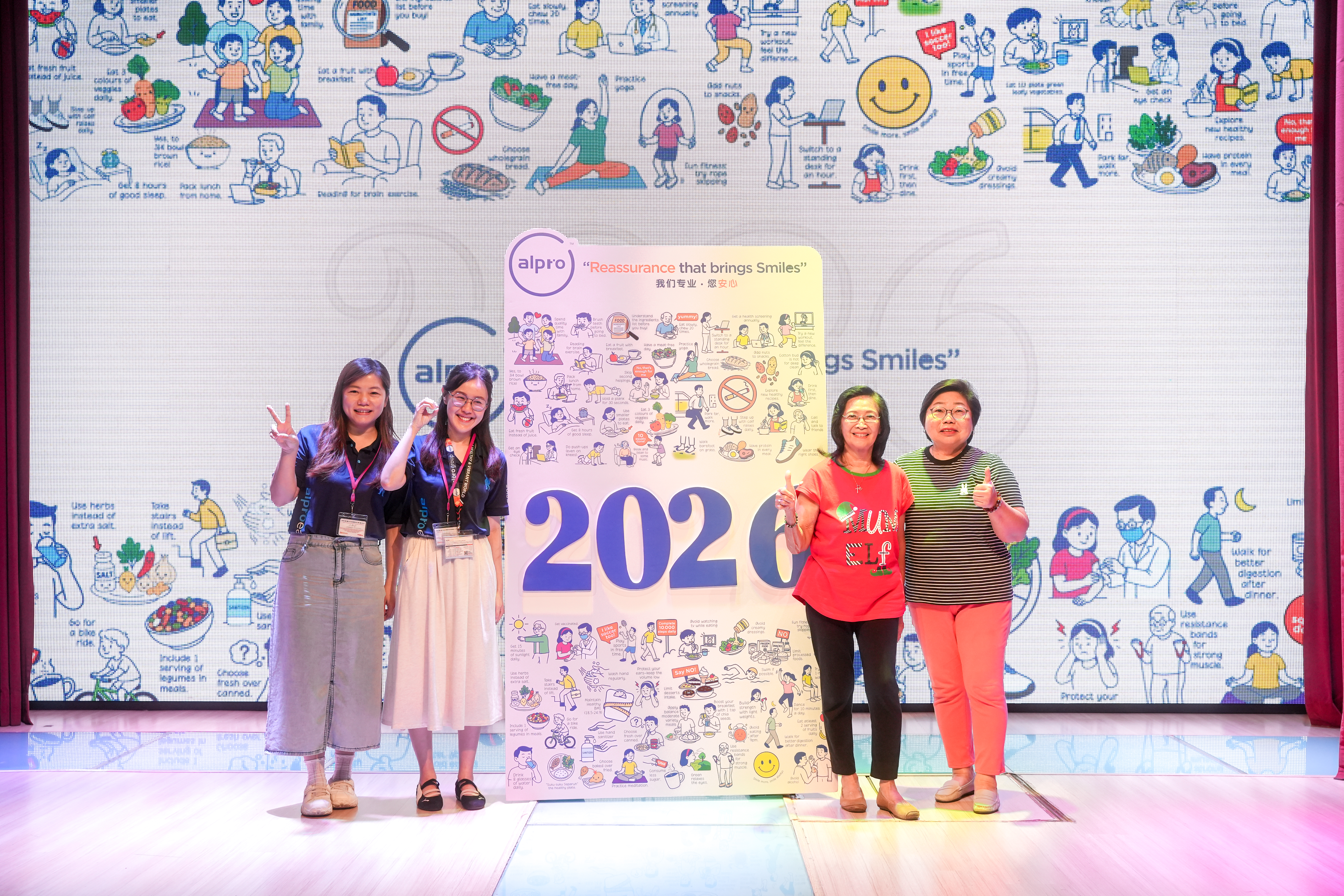 (From left: Ms. Winnie Hsiung (Alpro Trade Marketing Manager); Ms. Mindy Leong (Alpro Branding Manager); Alpro SilverSneakers members)