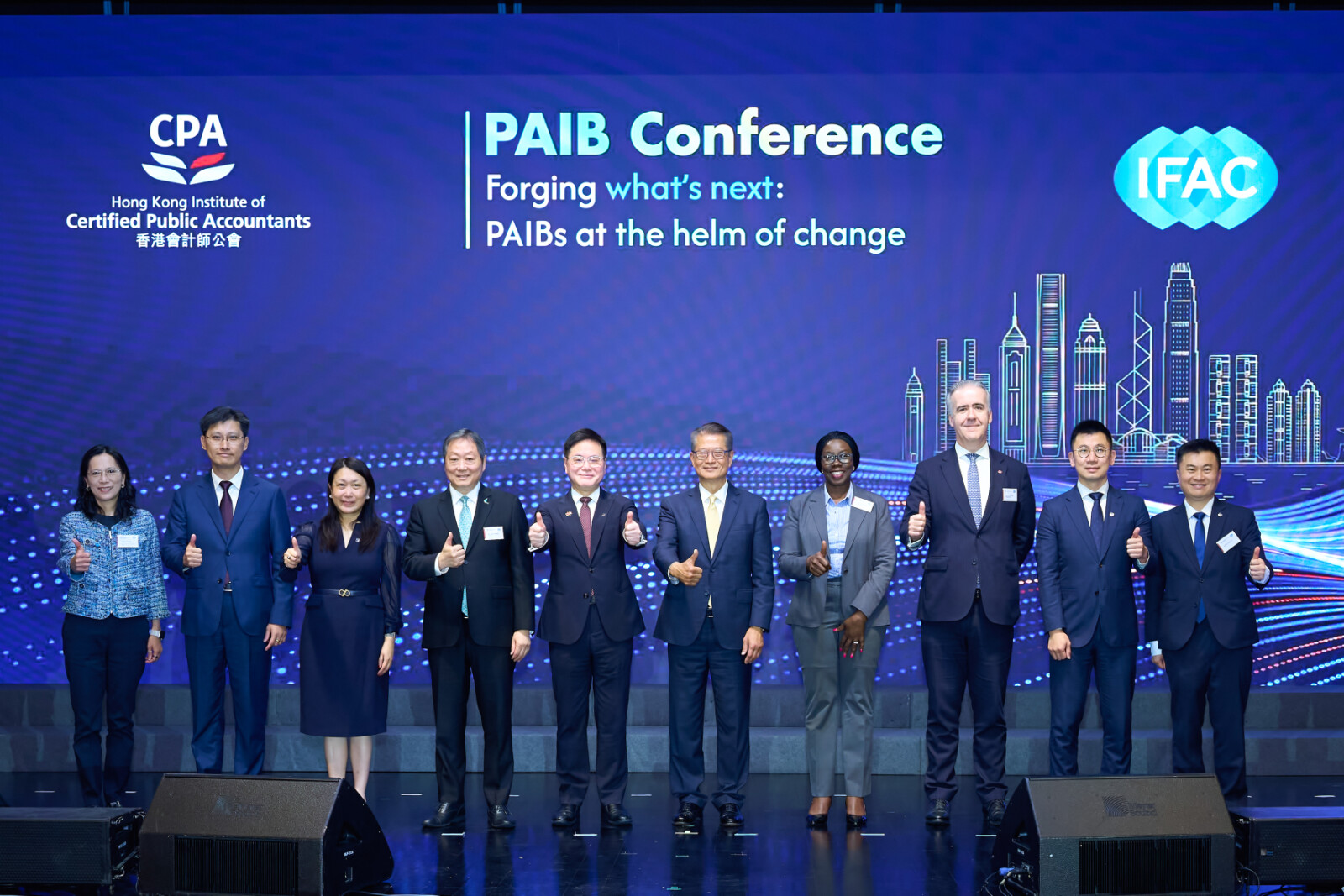 HKICPA and IFAC host landmark PAIB Conference to gather global elites and explore future of finance leaders in a changing global landscape Paul Chan, Financial Secretary of the HKSAR Government (Fifth from Right), Stephen Law, HKICPA President (Fifth from Left), Josephine Okui Ossiya, Chair of the IFAC PAIB Advisory Group (Fourth from Right) and Dr. Kelvin Wong, Chairman of the Securities and Futures Commission (Fourth from Left), Michael George Fitzgerald, Finance Director of the MTR Corporation (Third from Right) and other distinguished guests gather for a group photo at the HKICPA x IFAC PAIB Conference.