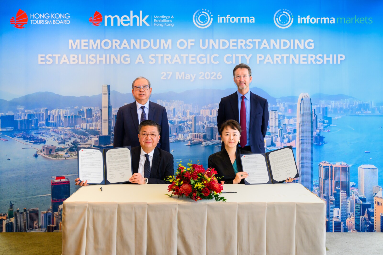 The Hong Kong Tourism Board and Informa Markets held a signing ceremony in Hong Kong today. The ceremony was witnessed by Dr. Peter Lam, HKTB Chairman (back left), and Mr. Stephen Carter, Group CEO, Informa Group (back right). Mr. Anthony Lau, HKTB Executive Director (front left), and Ms. Margaret Ma Connolly, President & CEO of Informa Markets Asia (front right), signed the Memorandum of Understanding on behalf. HKTB's partners and travel trade representatives also attended the ceremony in support of the partnership.