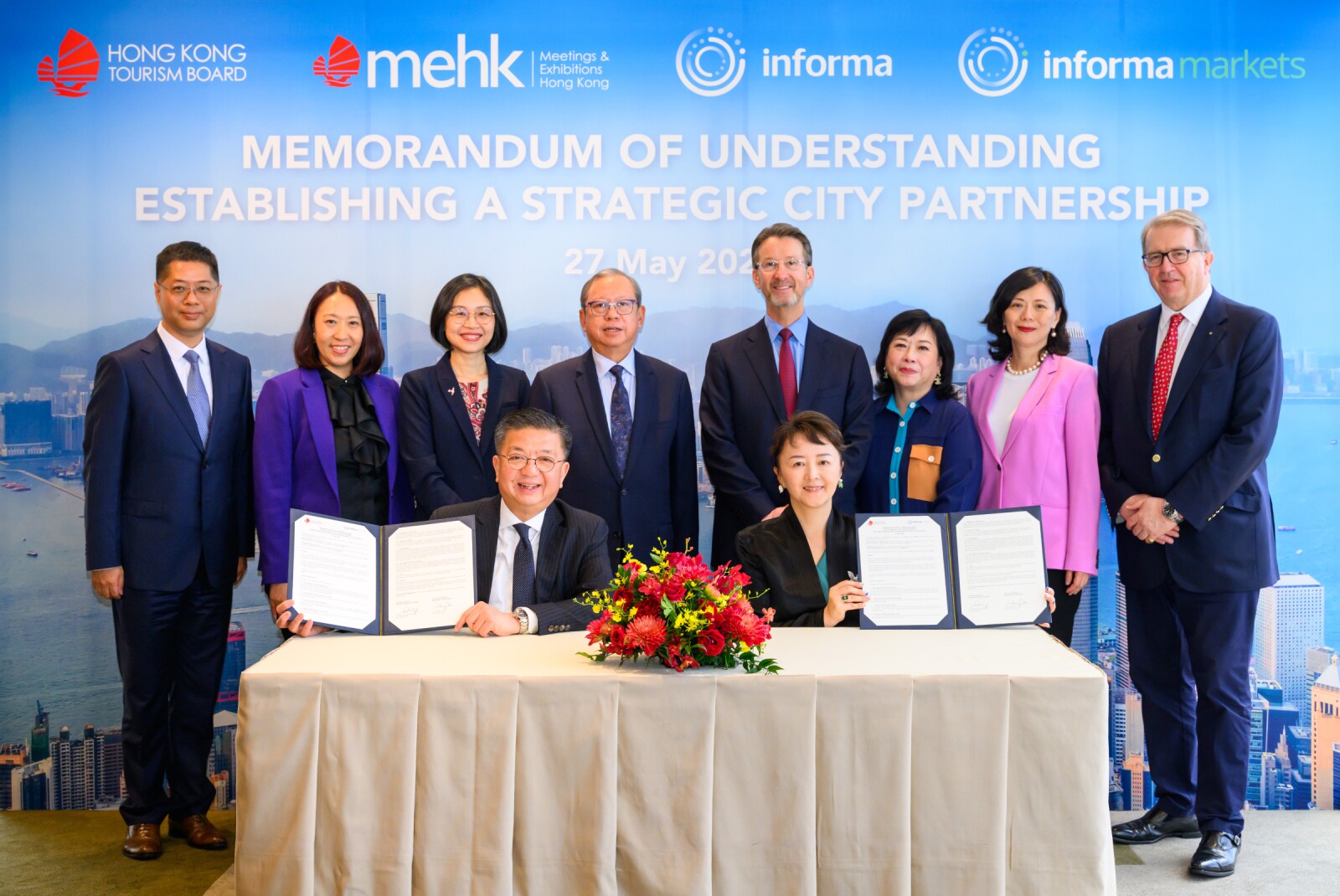 Major guests also posed for a group photograph after the signing ceremony, including: (back row, from left) Mr. Dan Ye, Vice President of Informa Markets, Ms. Marilyn Tham, HKTB General Manager of Mega Events, MICE & Cruise, Ms Joanne Chu, Acting Commissioner for Tourism, Dr. Peter Lam, HKTB Chairman, Mr. Stephen Carter, Group CEO, Informa Group, Ms. Enid Low, Chief Strategy Officer of AsiaWorld-Expo, Ms. Suzanne Wang, Chief Financial Officer of Informa Markets Asia, Mr. Michael Duck, EVP Commercial Development of Informa Markets Asia; and Mr. Anthony Lau, HKTB Executive Director (front left), and Ms. Margaret Ma Connolly, President & CEO of Informa Markets Asia (front right).