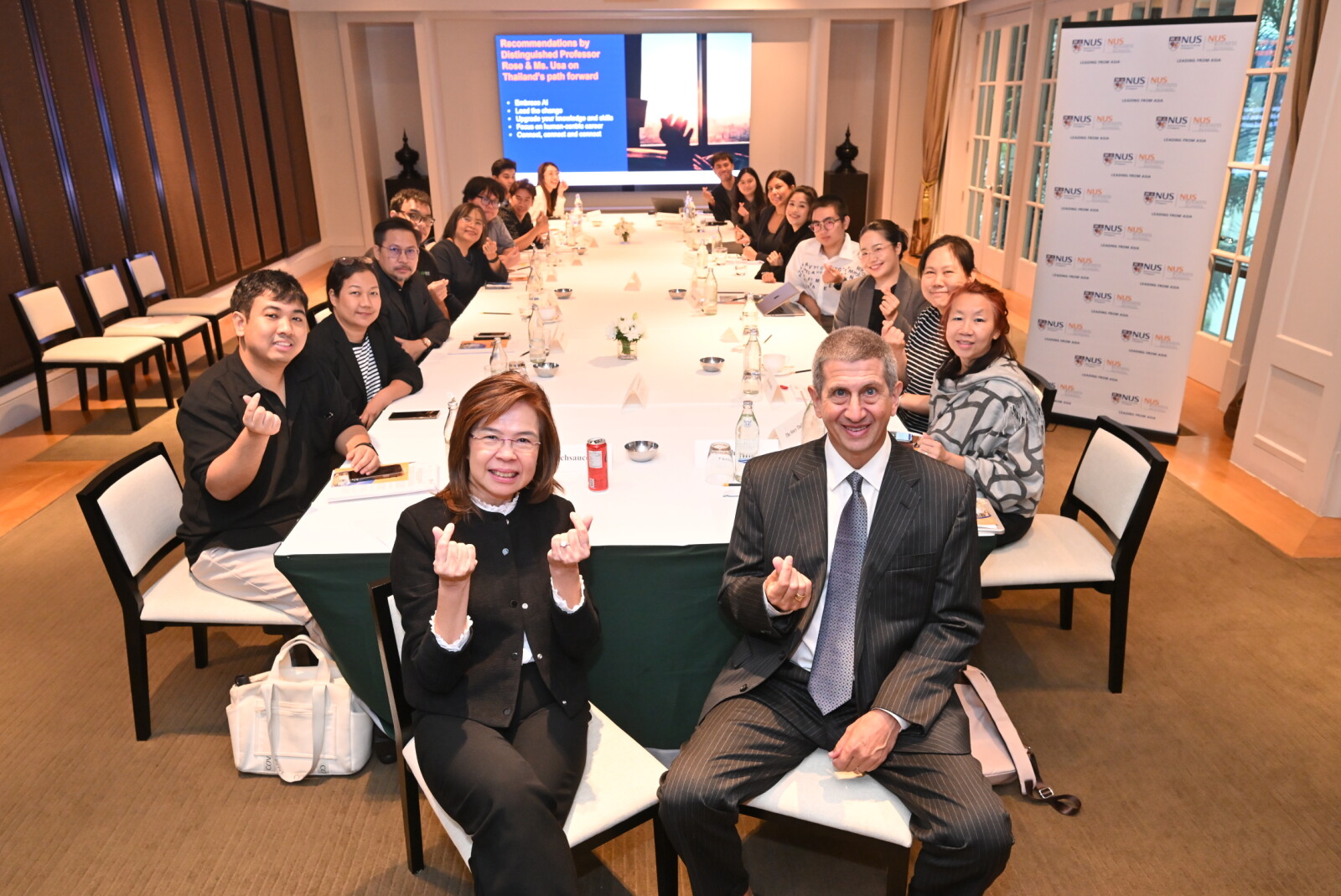 NUS Business School Senior Lecturer Ms Usa Skulkerewatana (foreground, first from left) and Distinguished Professor Andrew K. Rose, Dean of NUS Business School with Thai media representatives.
